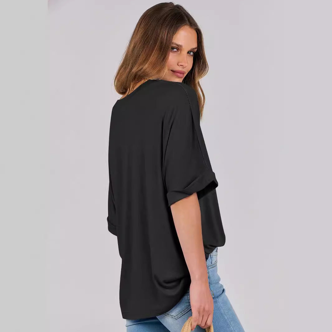 Women's Loose Fit black t-shirt with short sleeves, round neckline, and a relaxed fit. Made from soft, breathable fabric, perfect for casual wear.. Ideal for everyday comfort and effortless fashion