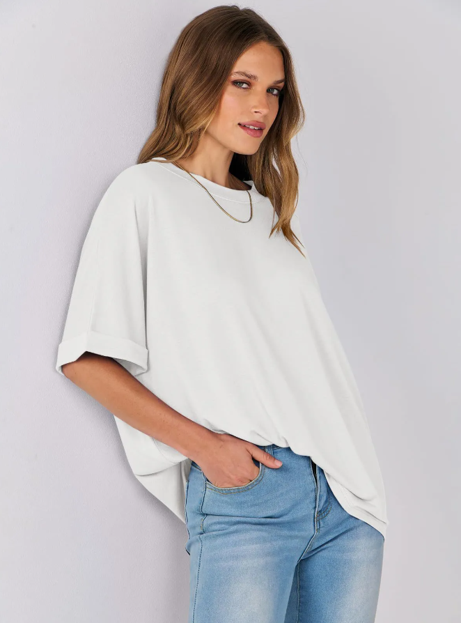 Women's Loose Fit white t-shirt with short sleeves, round neckline, and a relaxed fit. Made from soft, breathable fabric, perfect for casual wear.. Ideal for everyday comfort and effortless fashion