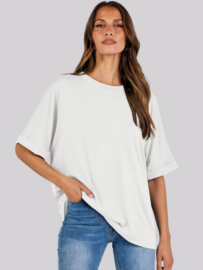 Women's Loose Fit white t-shirt with short sleeves, round neckline, and a relaxed fit. Made from soft, breathable fabric, perfect for casual wear.. Ideal for everyday comfort and effortless fashion